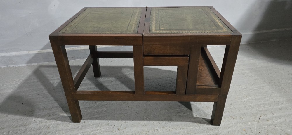 A set of dark mahogany library steps featuring four tiers inlaid with gold-tooled green leather treads. View VI