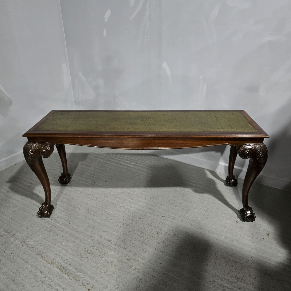 A mahogany console table featuring a green gold-tooled leather inset top and carved cabriole legs ending in ball-and-claw feet. View II
