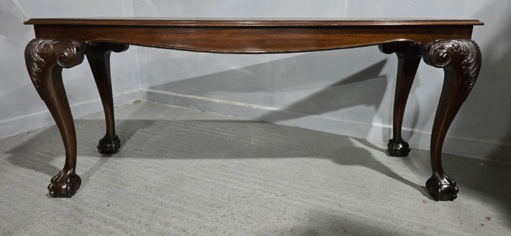 A mahogany console table featuring a green gold-tooled leather inset top and carved cabriole legs ending in ball-and-claw feet. View III