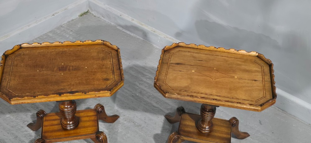 A pair of matching English walnut wine tables featuring gallery tops with wood inlay, turned central pedestals, and splayed legs. View VII