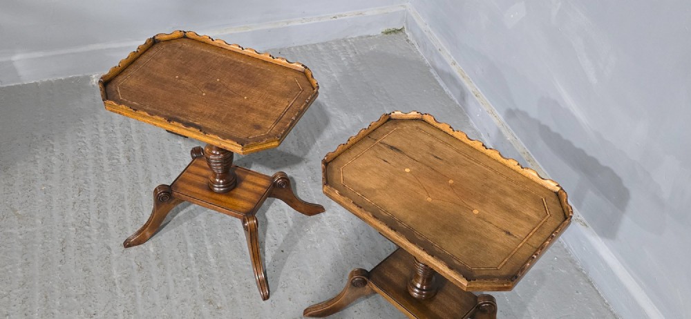 A pair of matching English walnut wine tables featuring gallery tops with wood inlay, turned central pedestals, and splayed legs. View XI