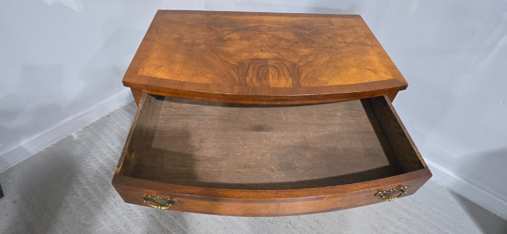 A Queen Anne style burr walnut lowboy table featuring cabriole legs with carved knees, pad feet, brass drop handles, and a shaped apron. View XI