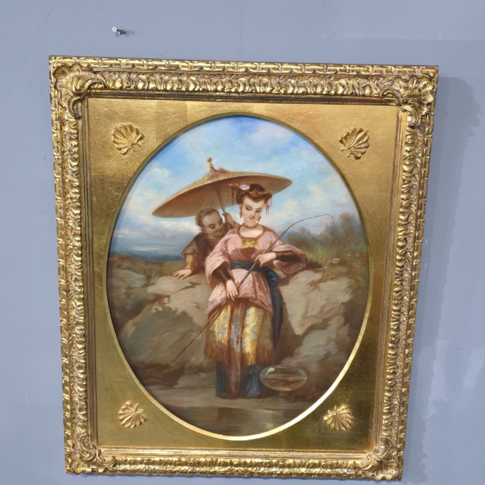 A 19th-century pastel painting depicting figures in traditional East Asian attire set within an oval mount inside a rectangular gilded frame with shell corner spandrels. View X