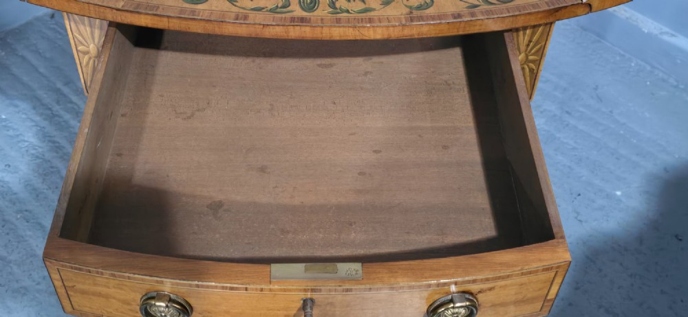 An antique painted satinwood Pembroke table featuring two drop leaves, hand-painted floral borders, turned tapering legs, and a single frieze drawer. View IX