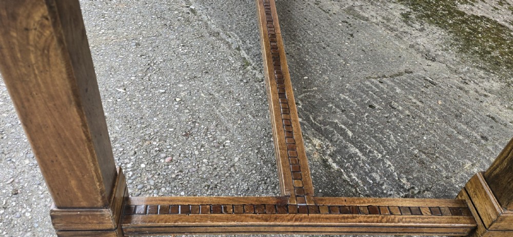 A large rectangular French refectory dining table featuring a patterned parquet timber top, square block legs, and a low stretcher base. View V