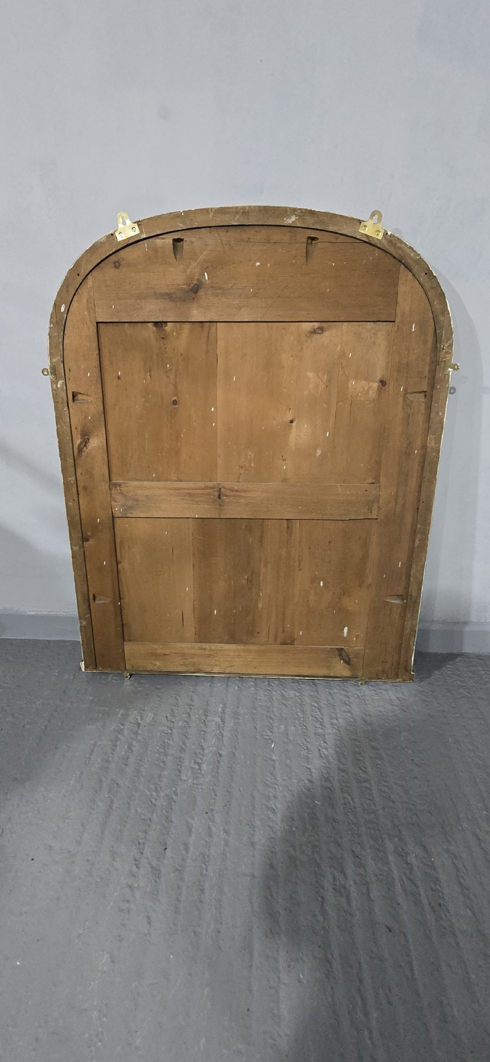 A Victorian arched overmantel mirror with an ornate gilded frame featuring detailed beaded moulding and a flat base. View VIII