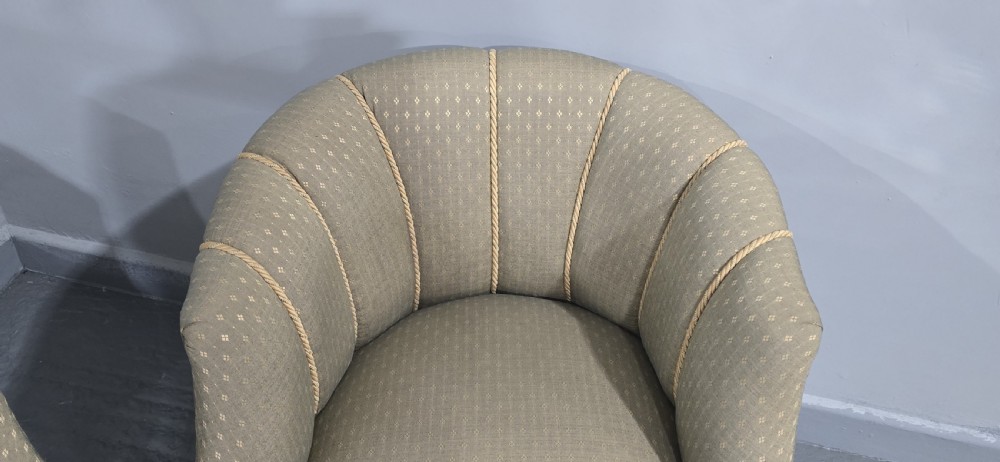 A pair of French walnut tub chairs upholstered in light beige patterned fabric with channelled backrests and turned wooden legs. View IX