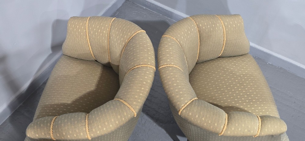 A pair of French walnut tub chairs upholstered in light beige patterned fabric with channelled backrests and turned wooden legs. View XIII