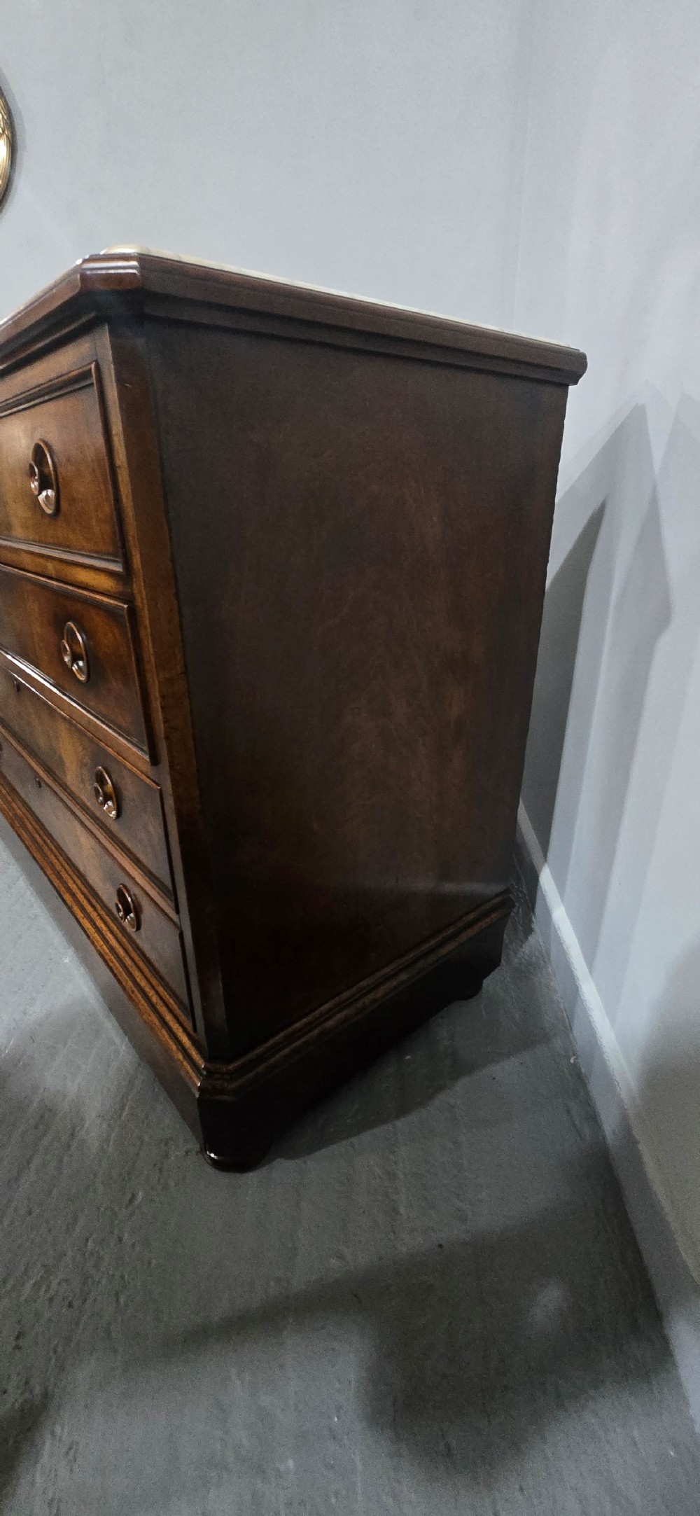 A nineteenth-century French walnut commode with four drawers, turned knobs, and a flat top. View XIV