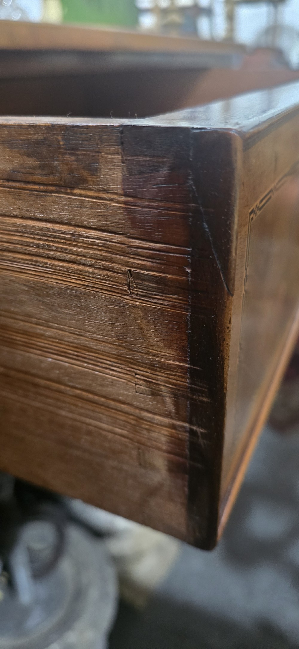 A nineteenth-century French walnut commode with four drawers, turned knobs, and a flat top. View XIX