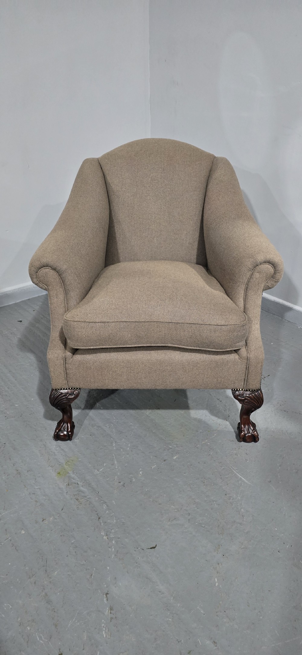 A traditional upholstered armchair in neutral taupe wool featuring carved mahogany cabriole front legs and claw-and-ball feet. View III