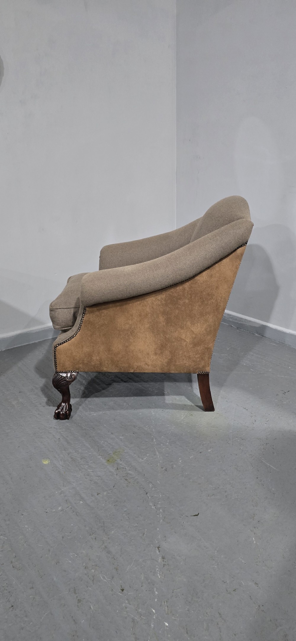 A traditional upholstered armchair in neutral taupe wool featuring carved mahogany cabriole front legs and claw-and-ball feet. View V