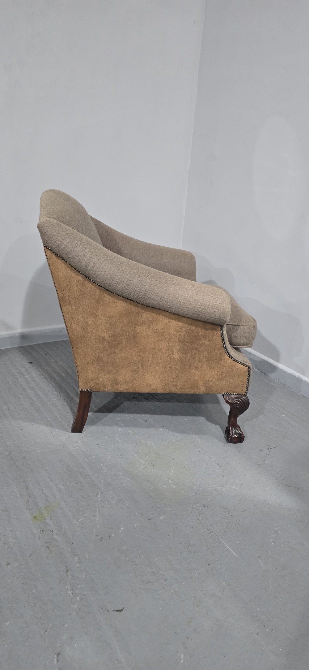 A traditional upholstered armchair in neutral taupe wool featuring carved mahogany cabriole front legs and claw-and-ball feet. View VII