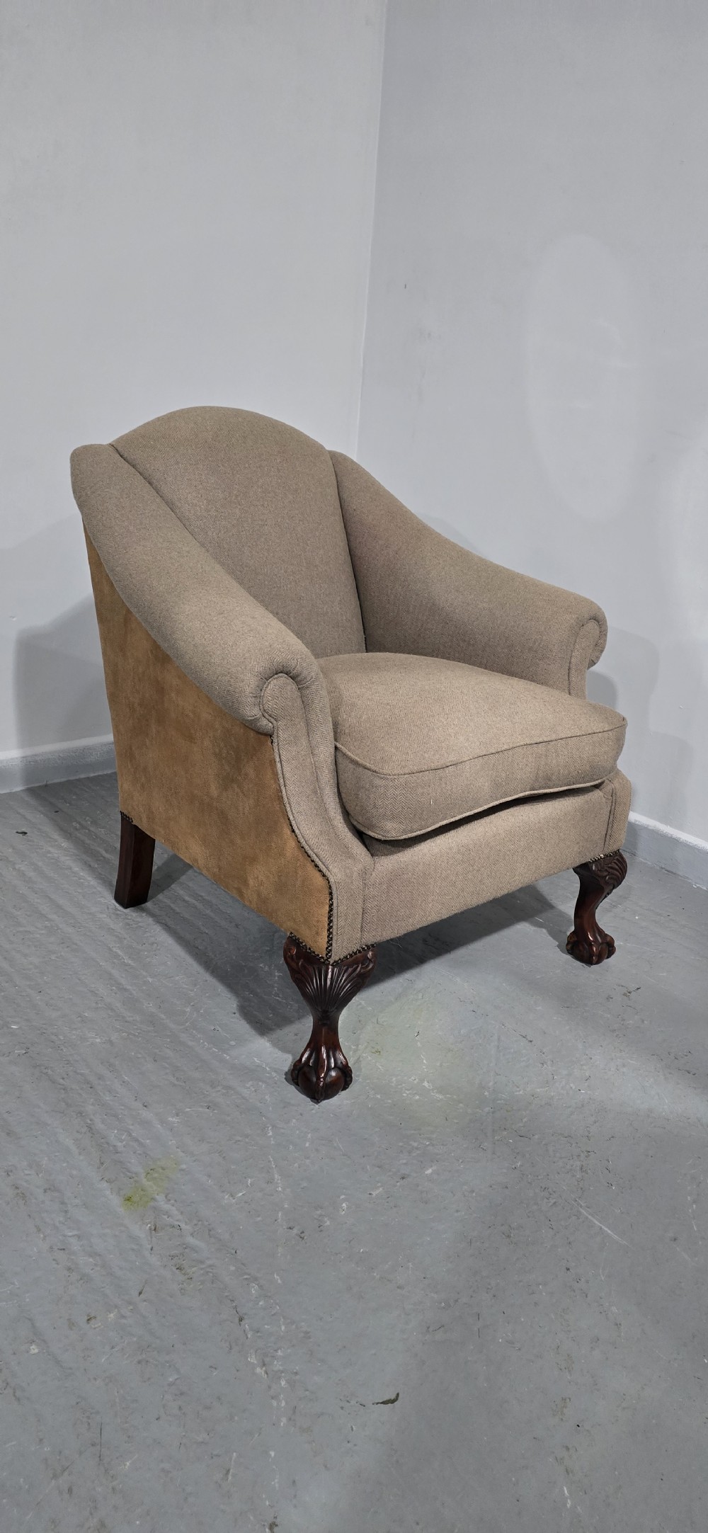 A traditional upholstered armchair in neutral taupe wool featuring carved mahogany cabriole front legs and claw-and-ball feet. View IX