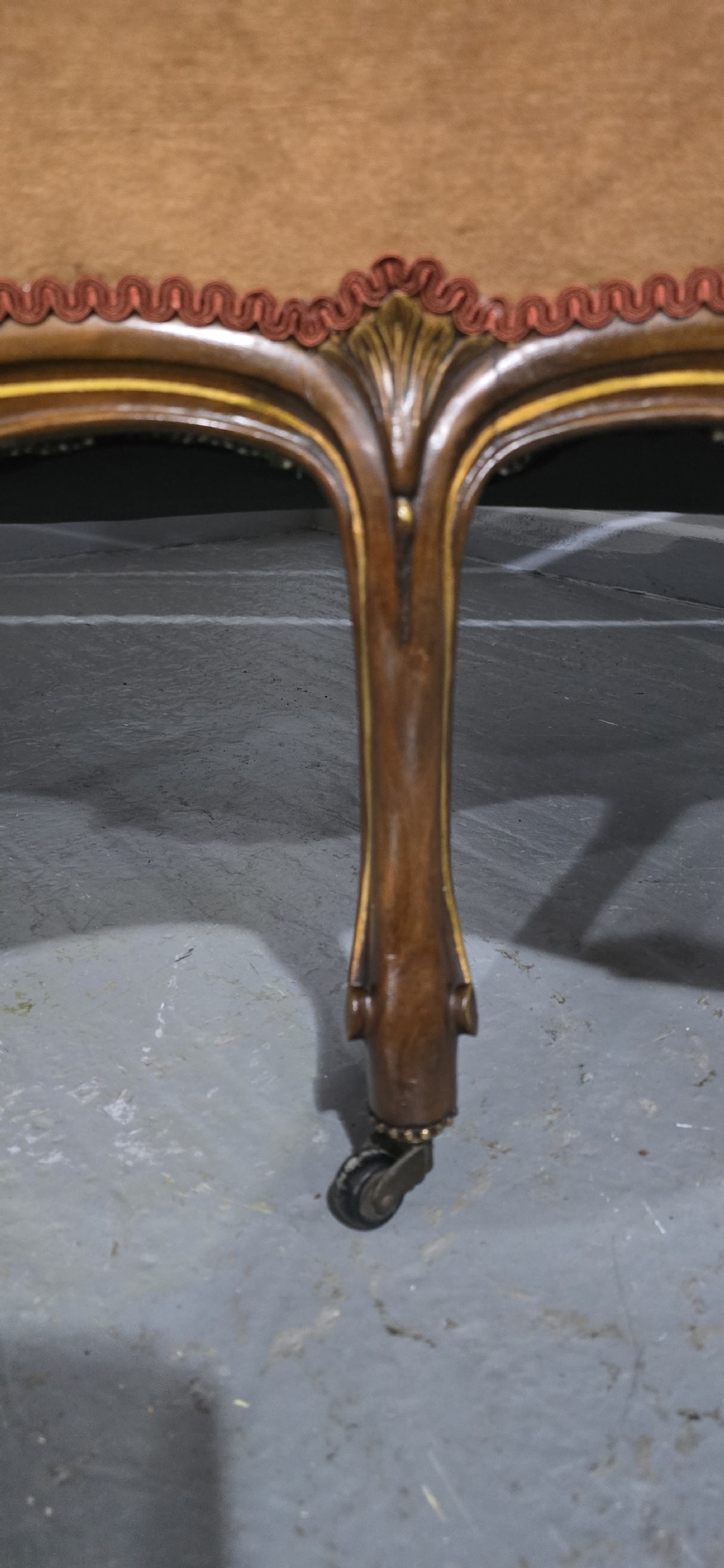 A French Louis XV style carved walnut settee with warm amber velvet upholstery, serpentine seat rail, and cabriole legs. View X