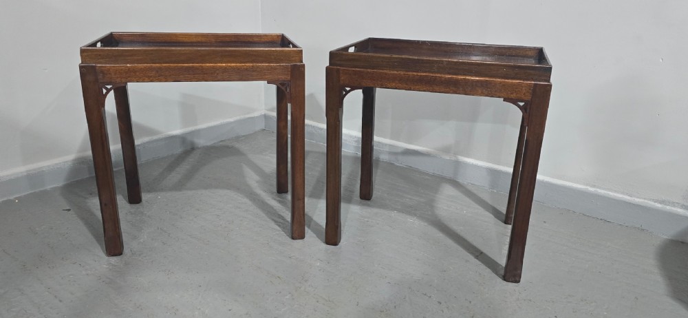 A pair of dark mahogany rectangular lamp tables featuring tray tops with cut-out handles and decorative fretwork corner brackets on straight legs. View III