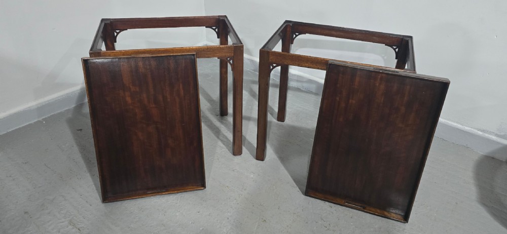 A pair of dark mahogany rectangular lamp tables featuring tray tops with cut-out handles and decorative fretwork corner brackets on straight legs. View VI