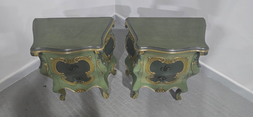 A pair of sage green and gold painted French Louis XV style bedside chests featuring bombee sides, cabriole legs, and ornate scroll moulding. View VII