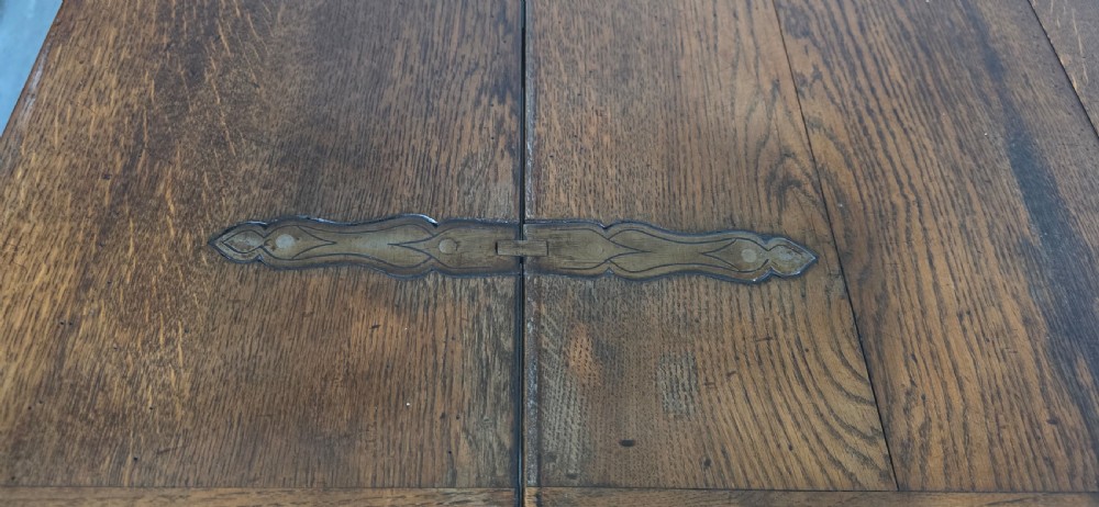 A long rectangular dark oak refectory dining table featuring turned wooden legs, a central stretcher, and a plank top. View XI