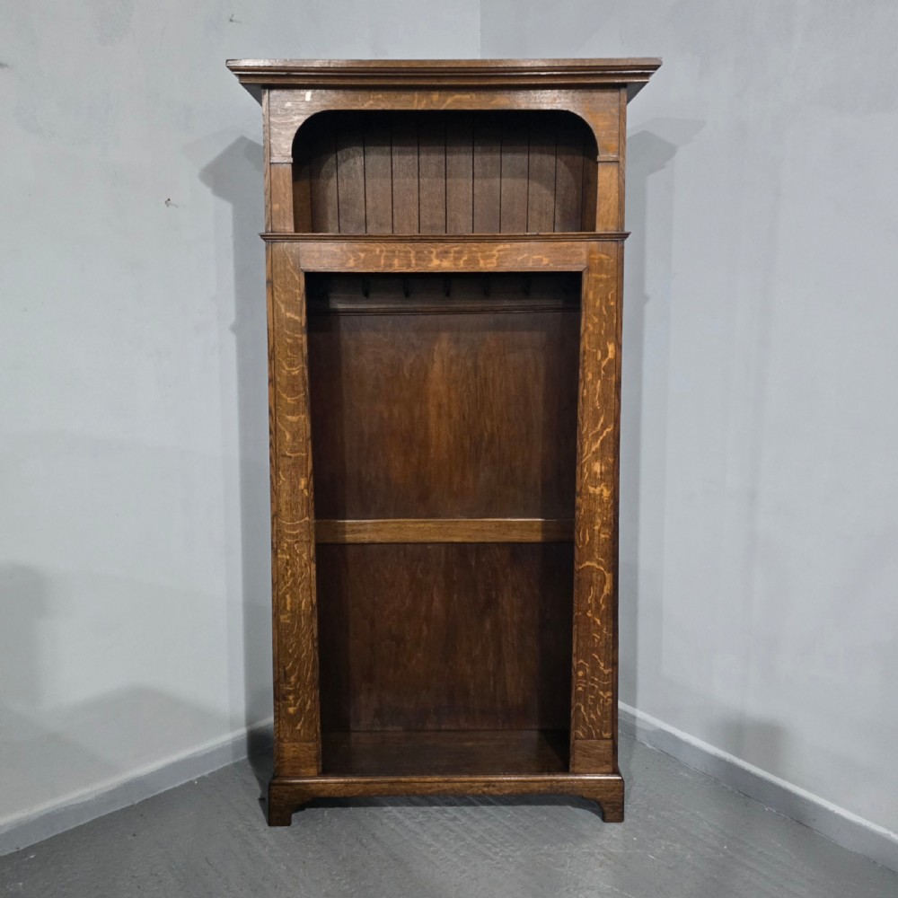 A dark oak open-fronted hanging hall robe featuring a top shelf with vertical back panelling and internal coat hooks. View II