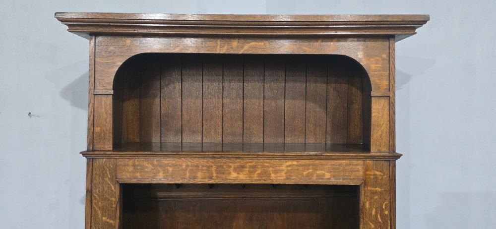A dark oak open-fronted hanging hall robe featuring a top shelf with vertical back panelling and internal coat hooks. View III