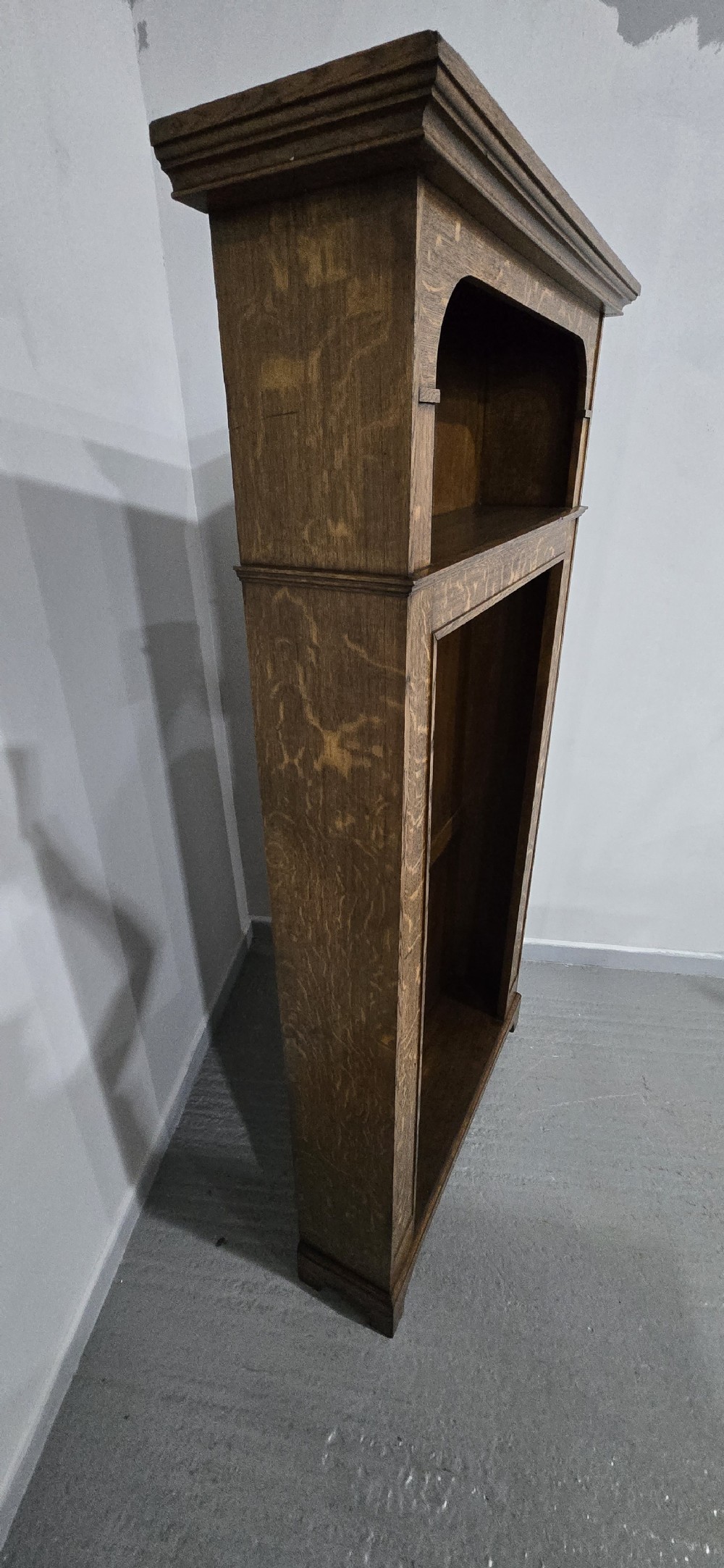 A dark oak open-fronted hanging hall robe featuring a top shelf with vertical back panelling and internal coat hooks. View VII