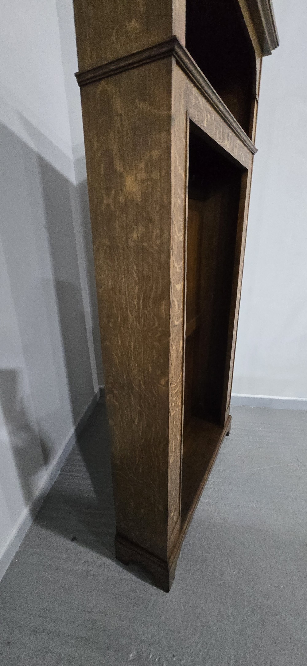 A dark oak open-fronted hanging hall robe featuring a top shelf with vertical back panelling and internal coat hooks. View VIII