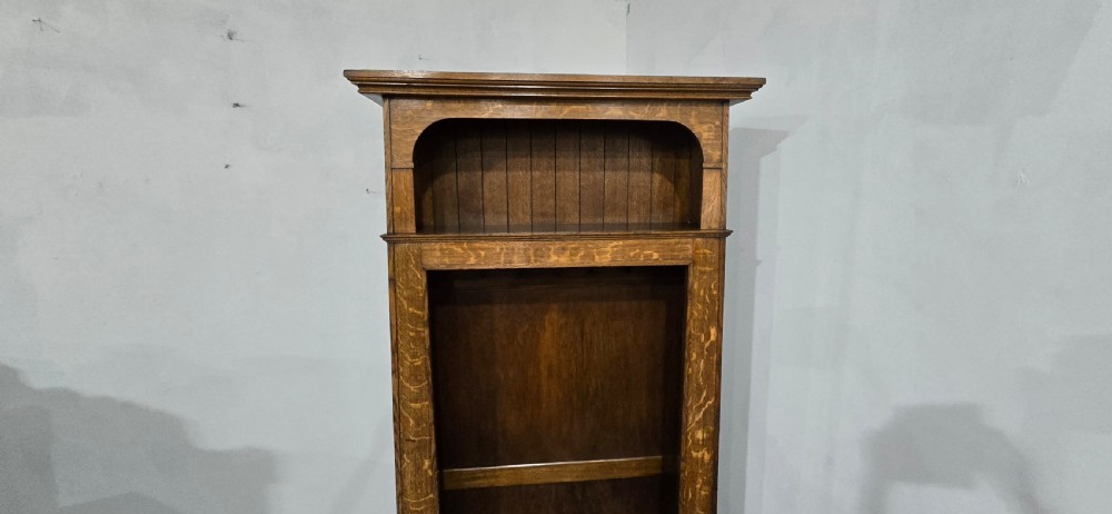 A dark oak open-fronted hanging hall robe featuring a top shelf with vertical back panelling and internal coat hooks. View X