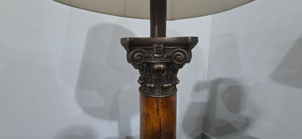 A pair of dark oak table lamps crafted in the form of Corinthian columns, topped with pleated white shades. View III