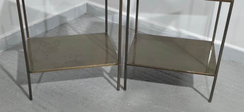 A pair of rectangular dark bronzed metal lamp tables featuring slender square legs and an integrated lower tier shelf. View II