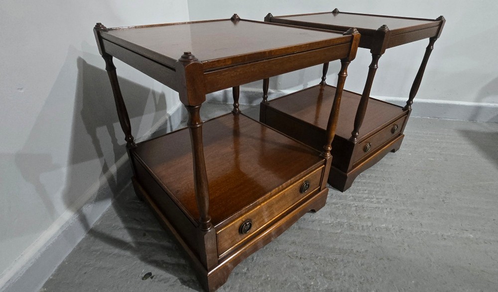 A pair of dark mahogany two-tier lamp tables with turned corner supports and single base drawers featuring brass ring handles. View VIII