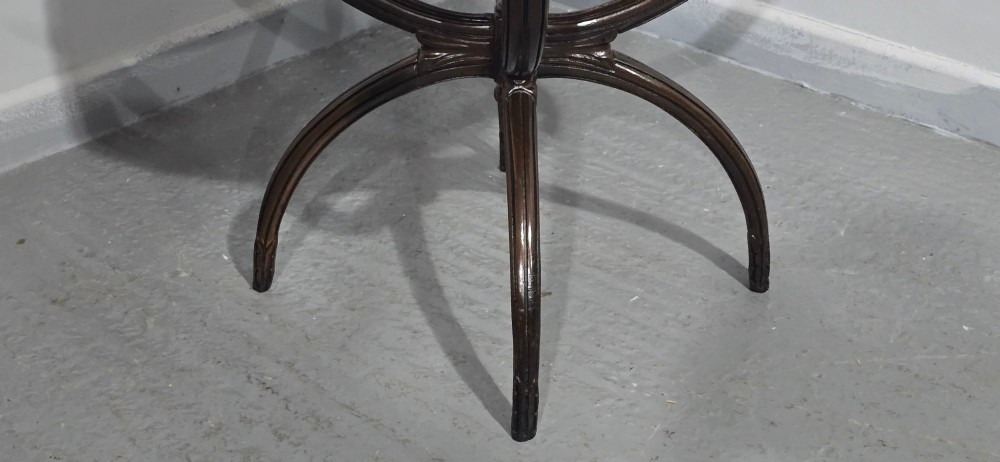 A circular mahogany occasional centre table with a segmented veneered top, brass lion mask handle, and curved reeded legs. View VIII
