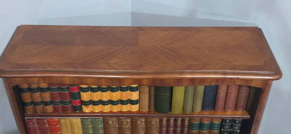 An open-fronted French walnut bookcase featuring adjustable internal shelves, a shaped apron, and short cabriole legs. View VI