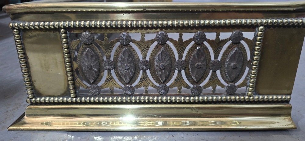 A wide Georgian brass and pierced cut steel fireplace fender with decorative geometric patterns and beaded borders. View VIII