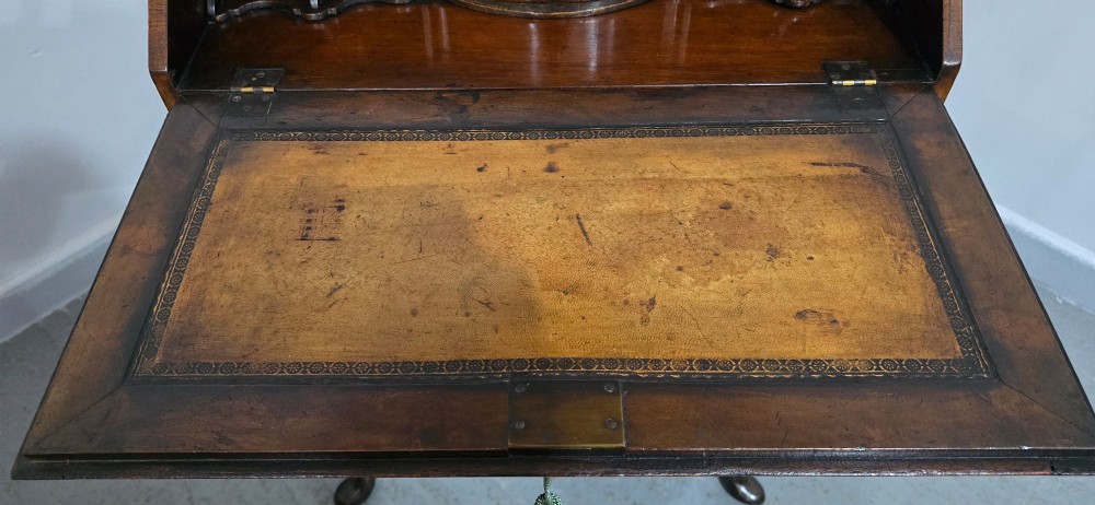 A Queen Anne style burr walnut writing bureau featuring a sloped front lid, shaped drawers with brass drop handles, and tall cabriole legs. View XI