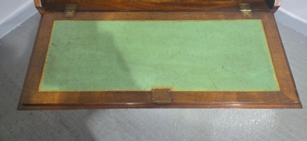 An antique Queen Anne burr walnut writing bureau featuring a sloping fall-front lid over four graduated drawers with brass drop handles and bracket feet. View XIV