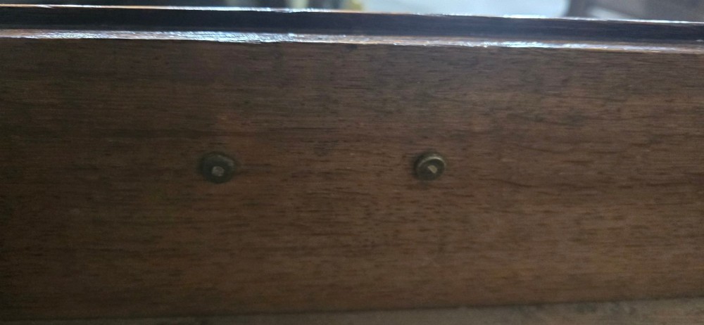 A Georgian oak chest of drawers featuring two short drawers above three long graduated drawers with brass swan-neck handles and bracket feet. View XII
