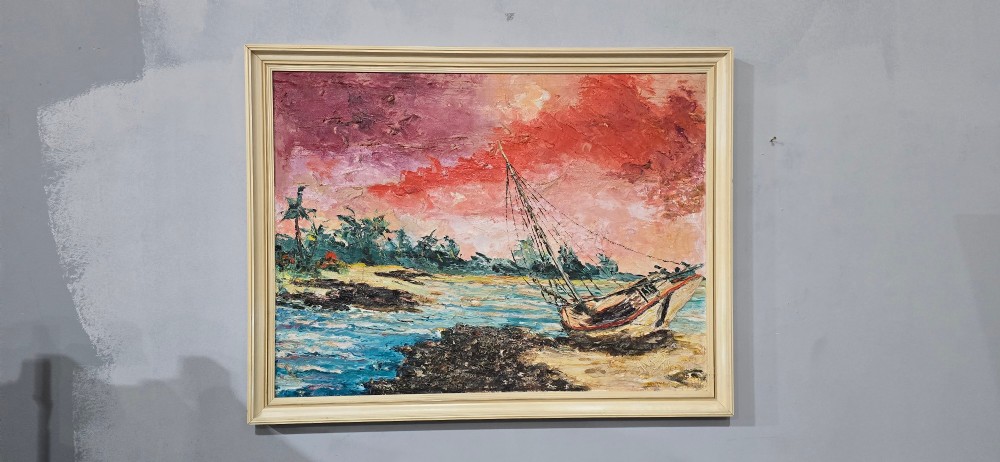 A framed impasto oil painting depicting a sailboat on a beach shoreline under a vibrant pink and red sky. View III
