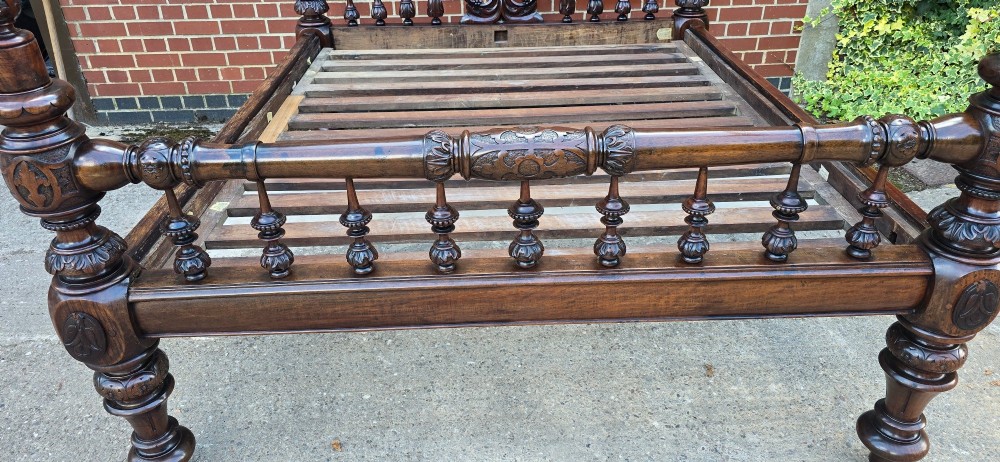 A dark wood four-poster bed frame featuring carved spiral posts, turned spindles, and an arched cresting headboard. View XIV