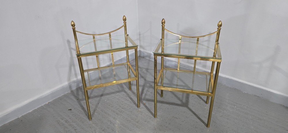Pair of two-tier brass side tables with clear glass shelves and decorative finials. View VI