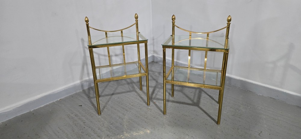 Pair of two-tier brass side tables with clear glass shelves and decorative finials. View XII