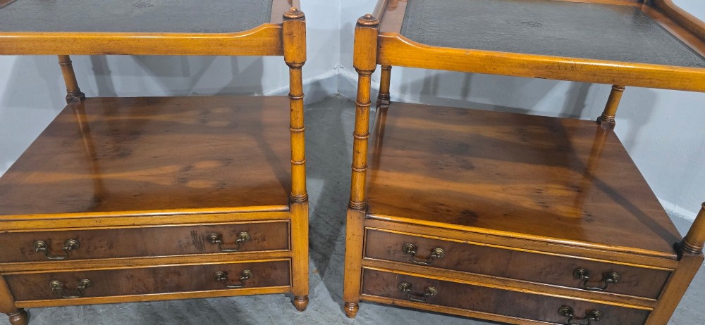A pair of yew wood lamp tables featuring dark green leather inset tops, a middle shelf, two drawers with brass handles, and turned corner columns. View IV