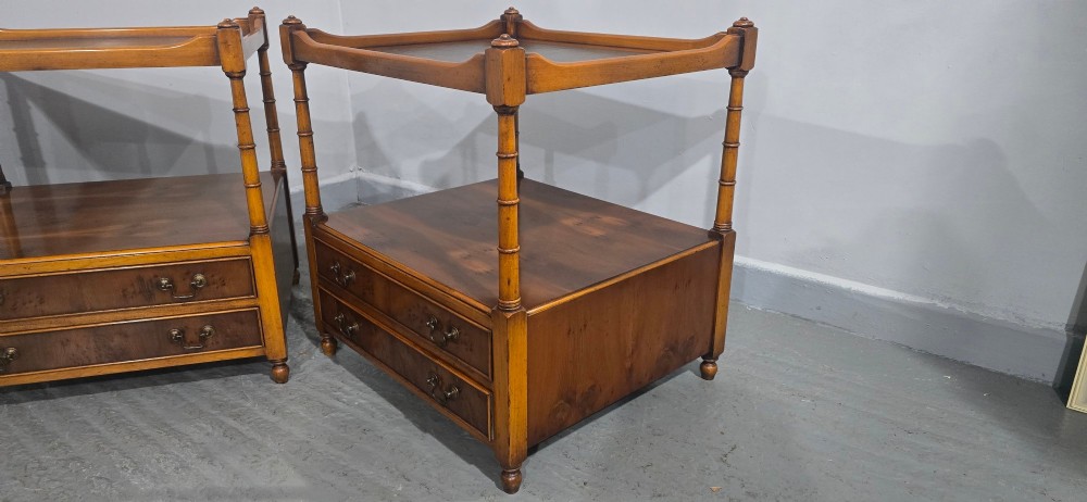 A pair of yew wood lamp tables featuring dark green leather inset tops, a middle shelf, two drawers with brass handles, and turned corner columns. View VI