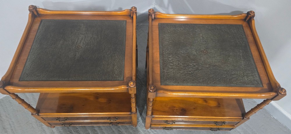 A pair of yew wood lamp tables featuring dark green leather inset tops, a middle shelf, two drawers with brass handles, and turned corner columns. View VII