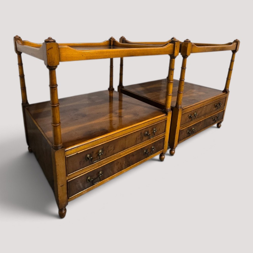 A pair of yew wood lamp tables featuring dark green leather inset tops, a middle shelf, two drawers with brass handles, and turned corner columns. View XII