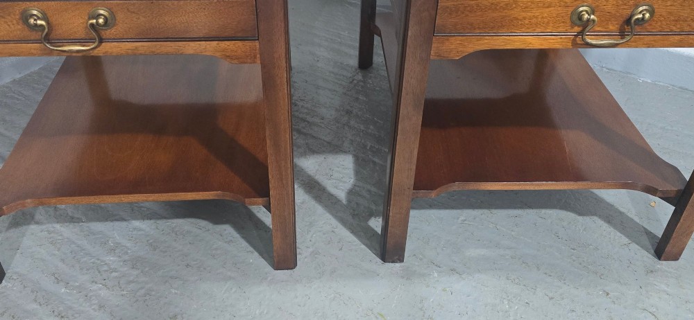 A pair of solid mahogany lamp end tables featuring tray tops, single drawers with brass handles, and lower tier shelves. View IV