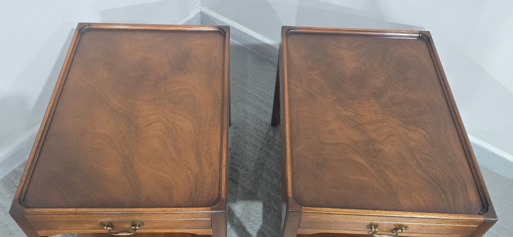 A pair of solid mahogany lamp end tables featuring tray tops, single drawers with brass handles, and lower tier shelves. View VI