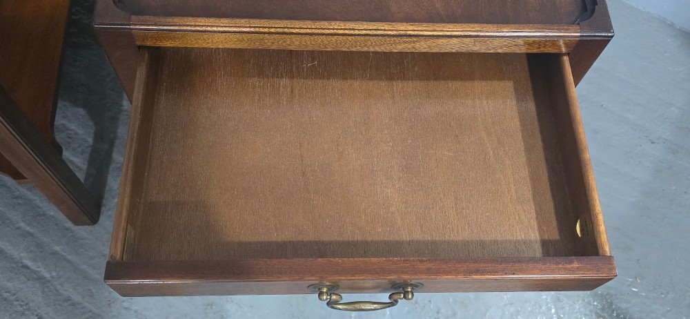 A pair of solid mahogany lamp end tables featuring tray tops, single drawers with brass handles, and lower tier shelves. View XI