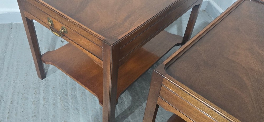 A pair of solid mahogany lamp end tables featuring tray tops, single drawers with brass handles, and lower tier shelves. View XIII