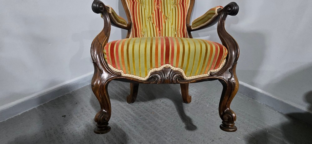 A Regency rosewood armchair featuring a button-tufted backrest, scrolled arms, carved legs, and striped green and red upholstery. View XIII